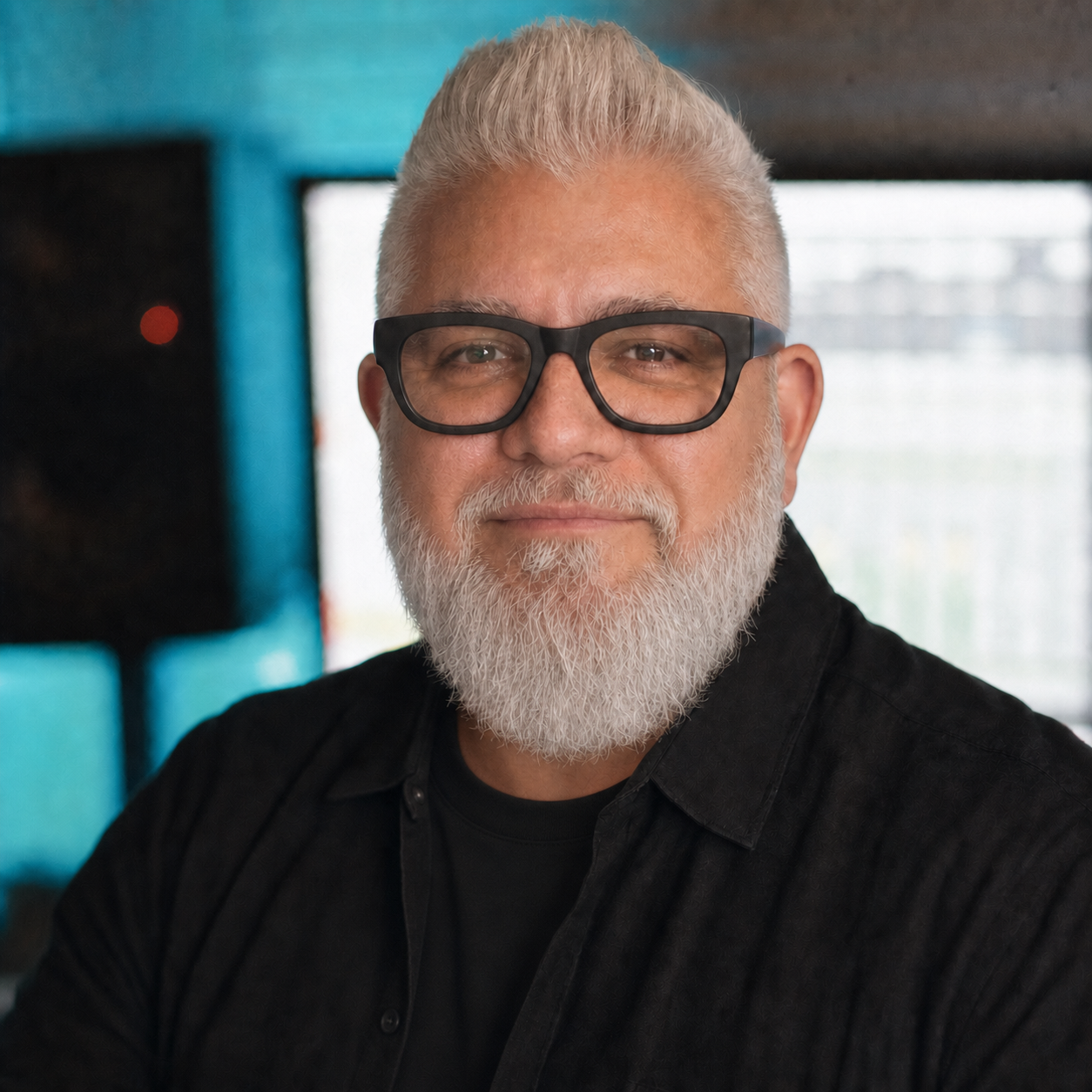 Portrait of Jay-J against a teal studio backdrop